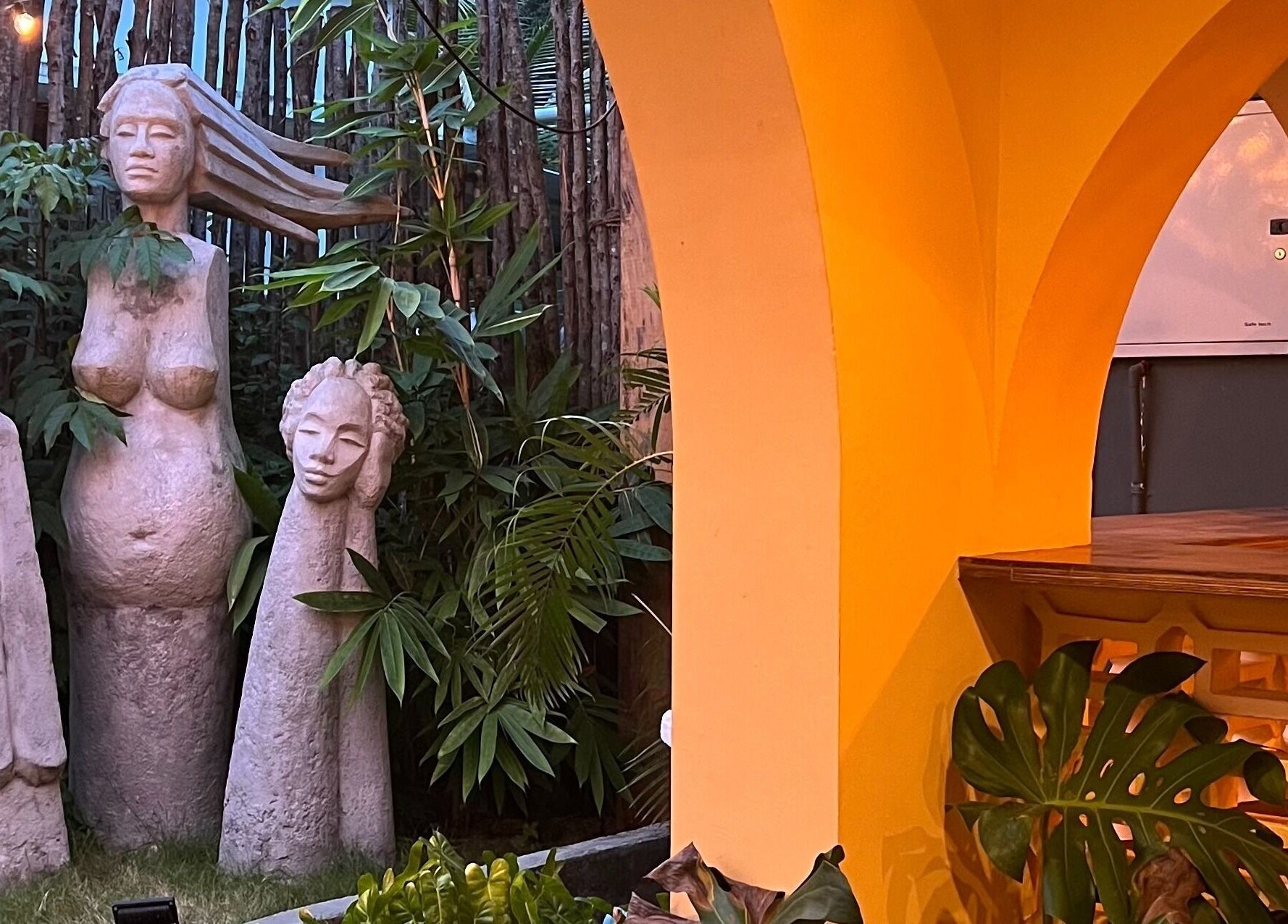 Elegant stone sculptures in a lush garden at Praana Ayur Spa by Sarwaa, Varkala, Kerala, IN.
