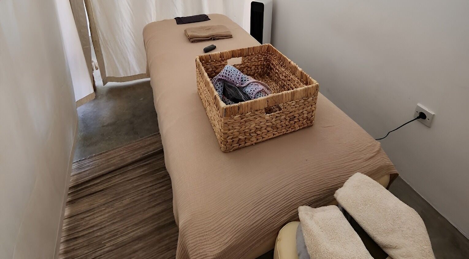 Relaxing massage room at Massage Point Bali, featuring a comfortable bed with towels in Bali, Bali, ID.