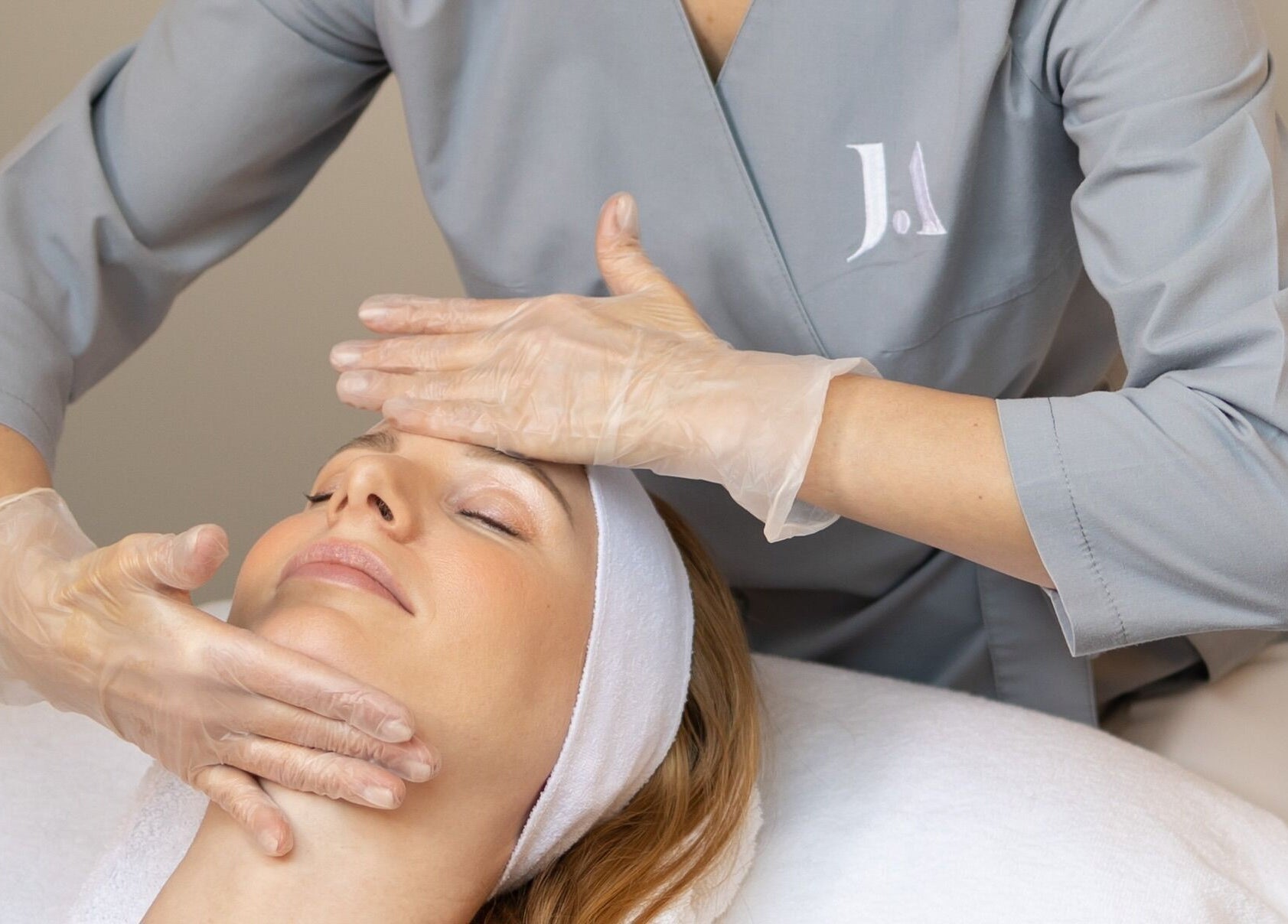 Facial massage at Fitzrovia Aesthetics, London, England, GB, showcasing expert spa treatments.