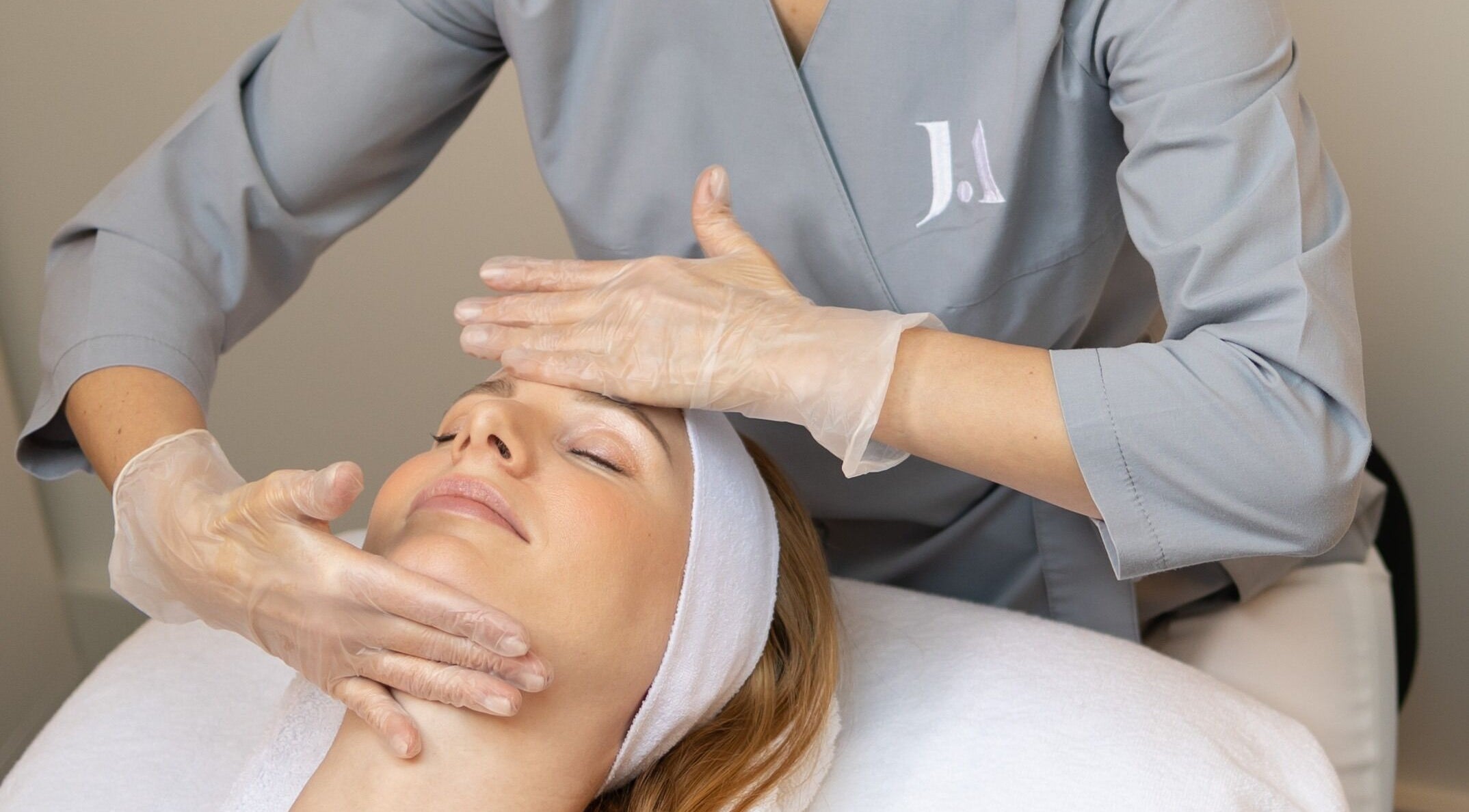 Facial massage at Fitzrovia Aesthetics, London, England, GB, showcasing expert spa treatments.