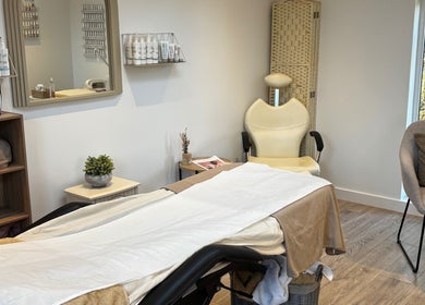 Calm treatment room at Beauty By Lucy Clare, Craven Arms, England, GB with a well-prepared massage table.