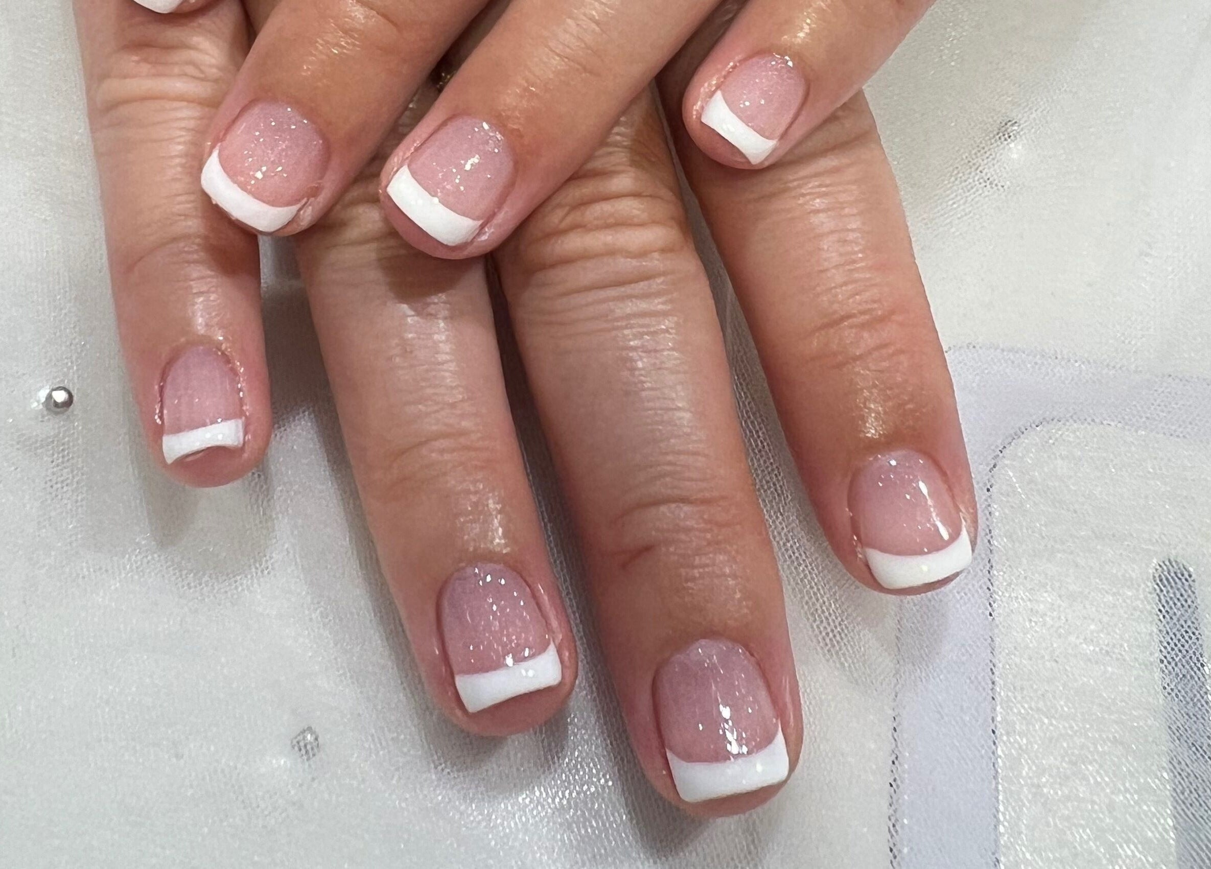 French manicure at Coco Nails and Beauty in Auckland, Auckland, NZ. Neatly polished hands with white tips.