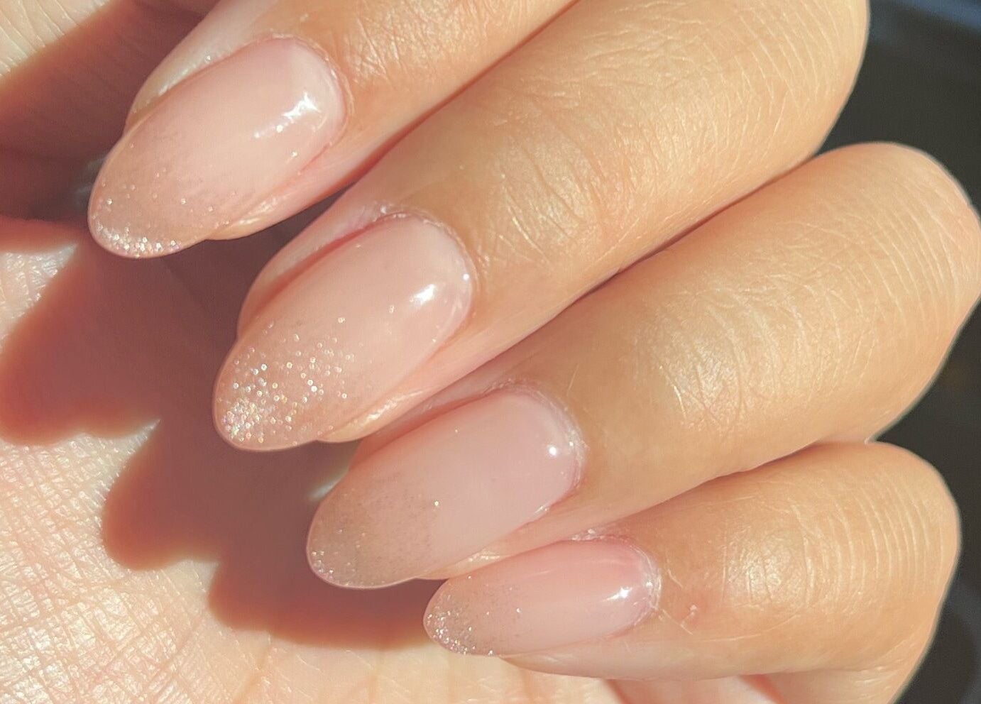 Elegant pink gel nails with glitter at Coco Nails and Beauty located in Auckland, Auckland, NZ.