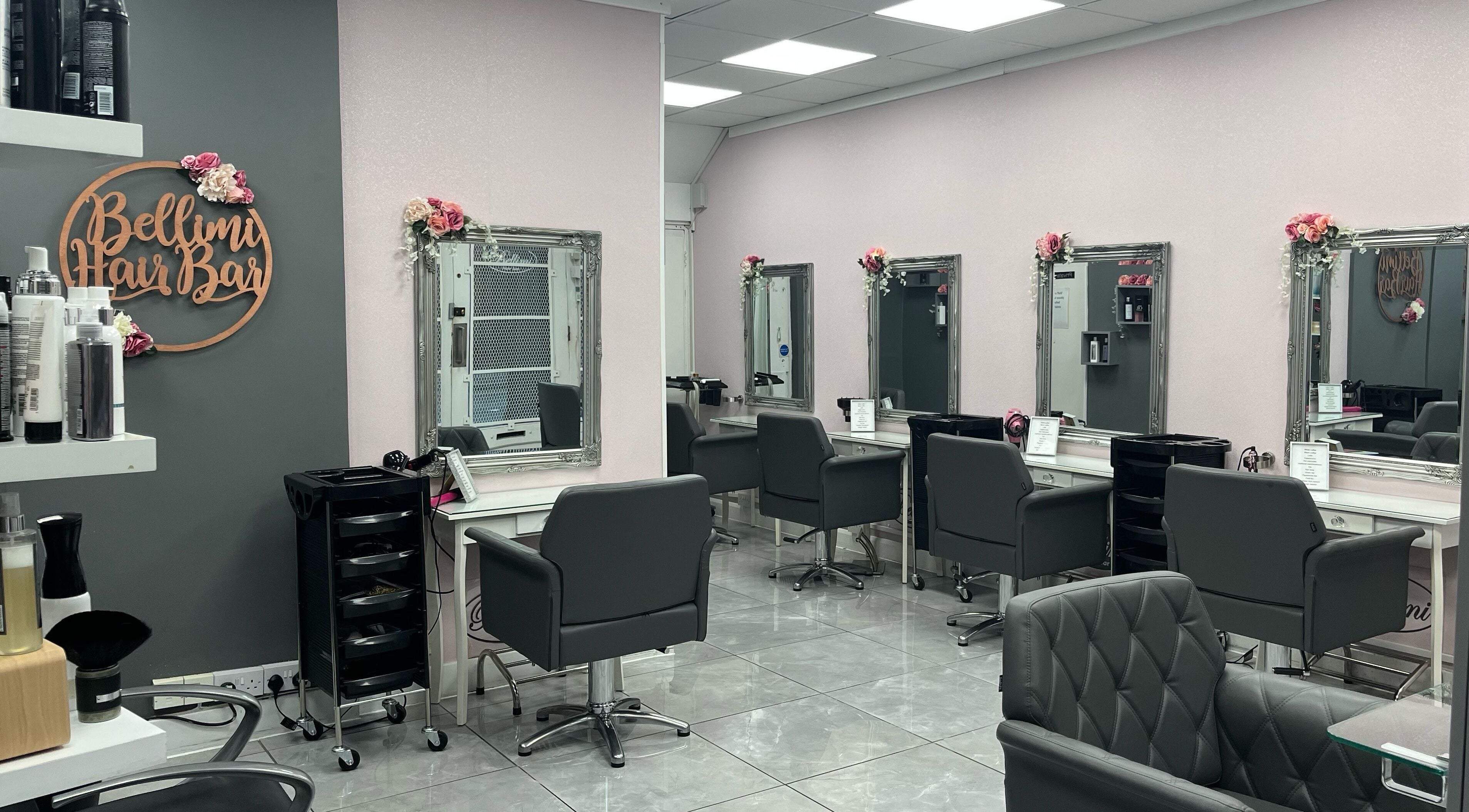 Elegant salon chairs and mirrors at Bellimi Hair Bar in Tonbridge, England, GB, showcasing modern beauty services.