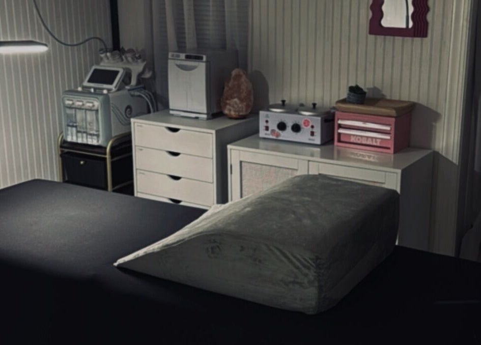 Massage room at Meraki and Co Salon LLC in Greer, South Carolina, US, featuring a treatment bed and spa equipment.