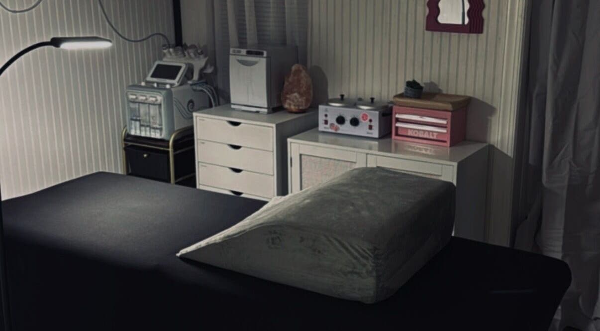 Massage room at Meraki and Co Salon LLC in Greer, South Carolina, US, featuring a treatment bed and spa equipment.