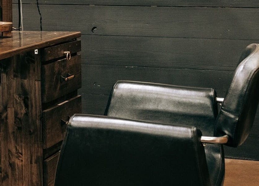 Chic salon chair in Meraki and Co Salon LLC, Greer, South Carolina, US, reflecting rustic wooden decor.