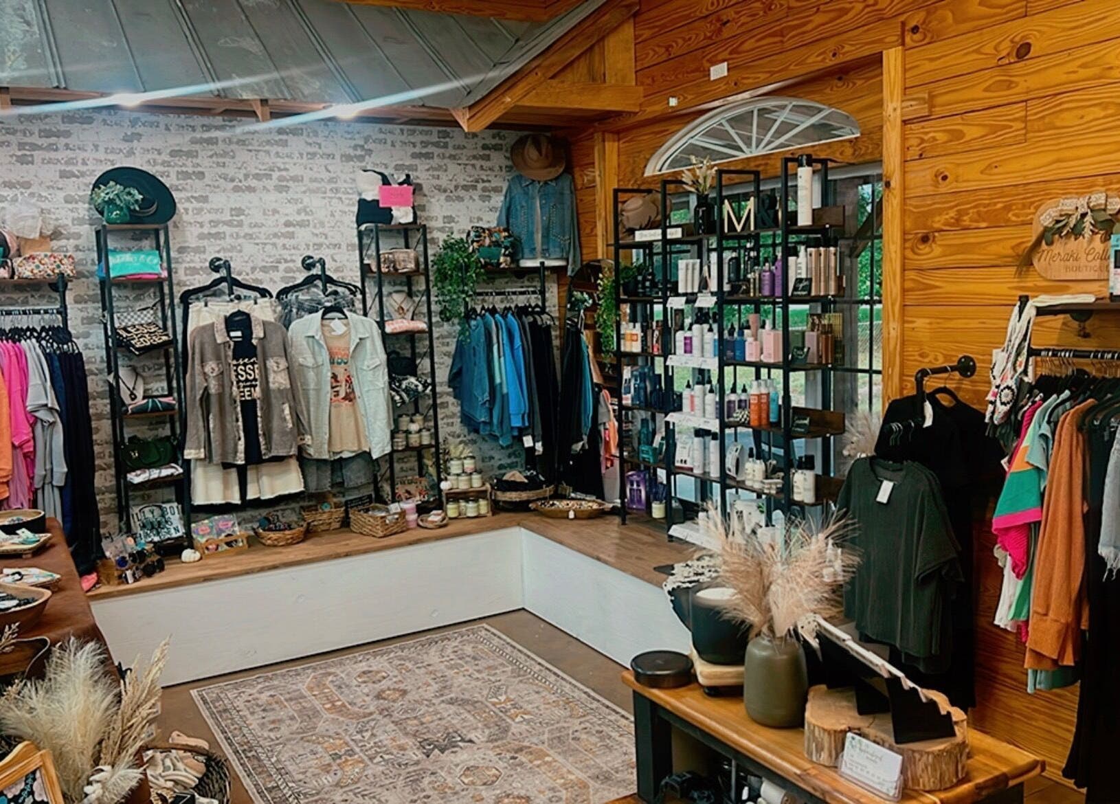 Trendy clothes and beauty products at Meraki and Co Salon LLC, Greer, South Carolina, US, in a stylish setup.