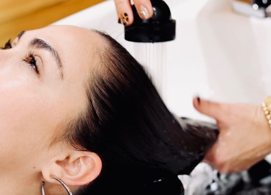 Relaxing hair wash at Meraki and Co Salon LLC, Greer, South Carolina, US, showcasing professional care.