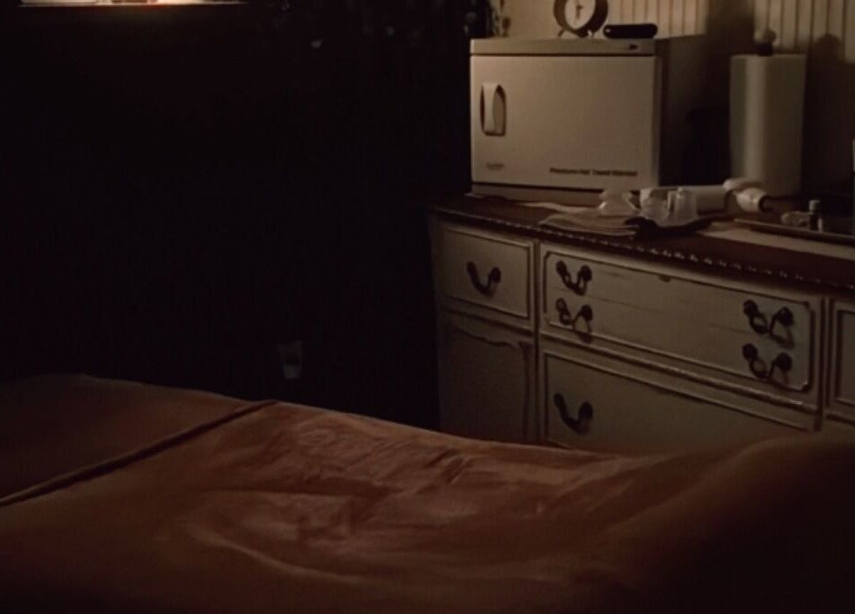 Tranquil massage room at Meraki and Co Salon LLC in Greer, South Carolina, US, featuring warm lighting and cozy decor.