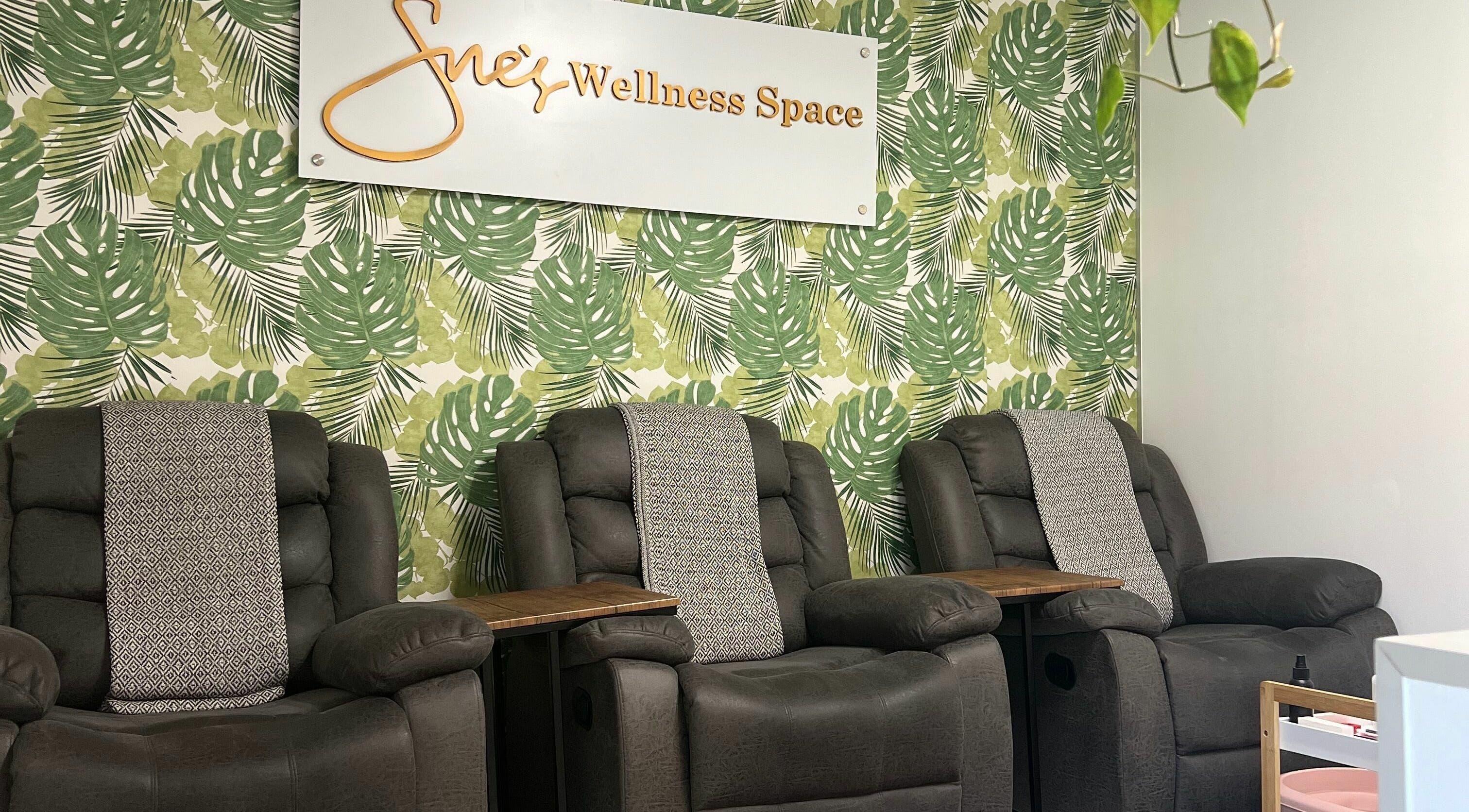Relaxation chairs at Snes Wellness Space in Sandton, Gauteng, ZA with tropical leaf wallpaper.