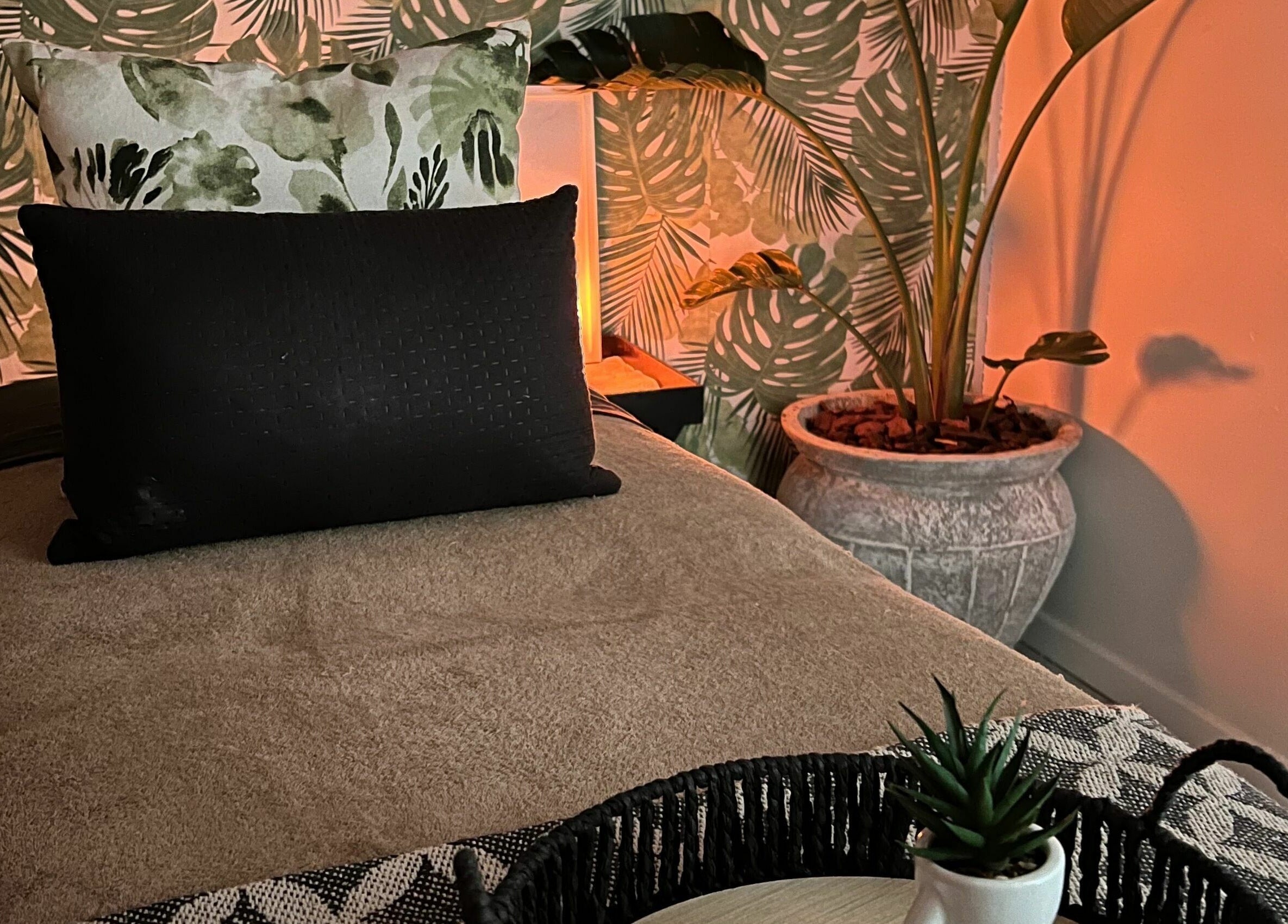 Relaxing massage room at Snes Wellness Space, Sandton, Gauteng, ZA with calming decor and plant accents.