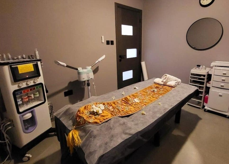Calming treatment room at Essence Healing Spa L.L.C. (Branch) in Dubai, Dubai, AE with massage table and equipment.