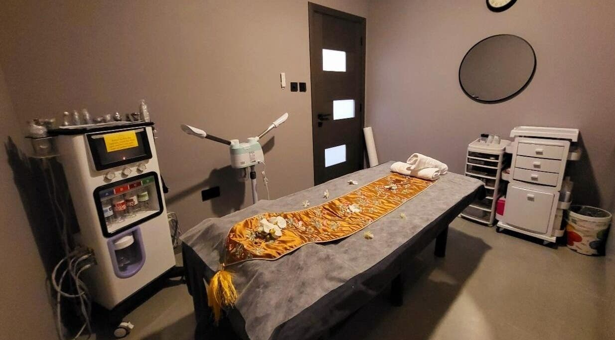 Calming treatment room at Essence Healing Spa L.L.C. (Branch) in Dubai, Dubai, AE with massage table and equipment.