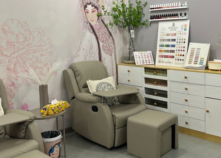 Relaxing lounge at Essence Healing Spa L.L.C. (Branch), Dubai, Dubai, AE, with cozy chairs and nail polish displays.
