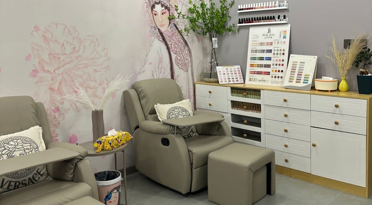 Relaxing lounge at Essence Healing Spa L.L.C. (Branch), Dubai, Dubai, AE, with cozy chairs and nail polish displays.