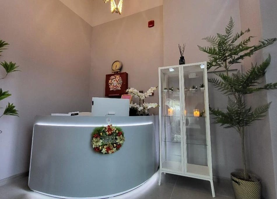 Reception area at Essence Healing Spa L.L.C. (Branch), Dubai, Dubai, AE, featuring elegant decor and calming plants.