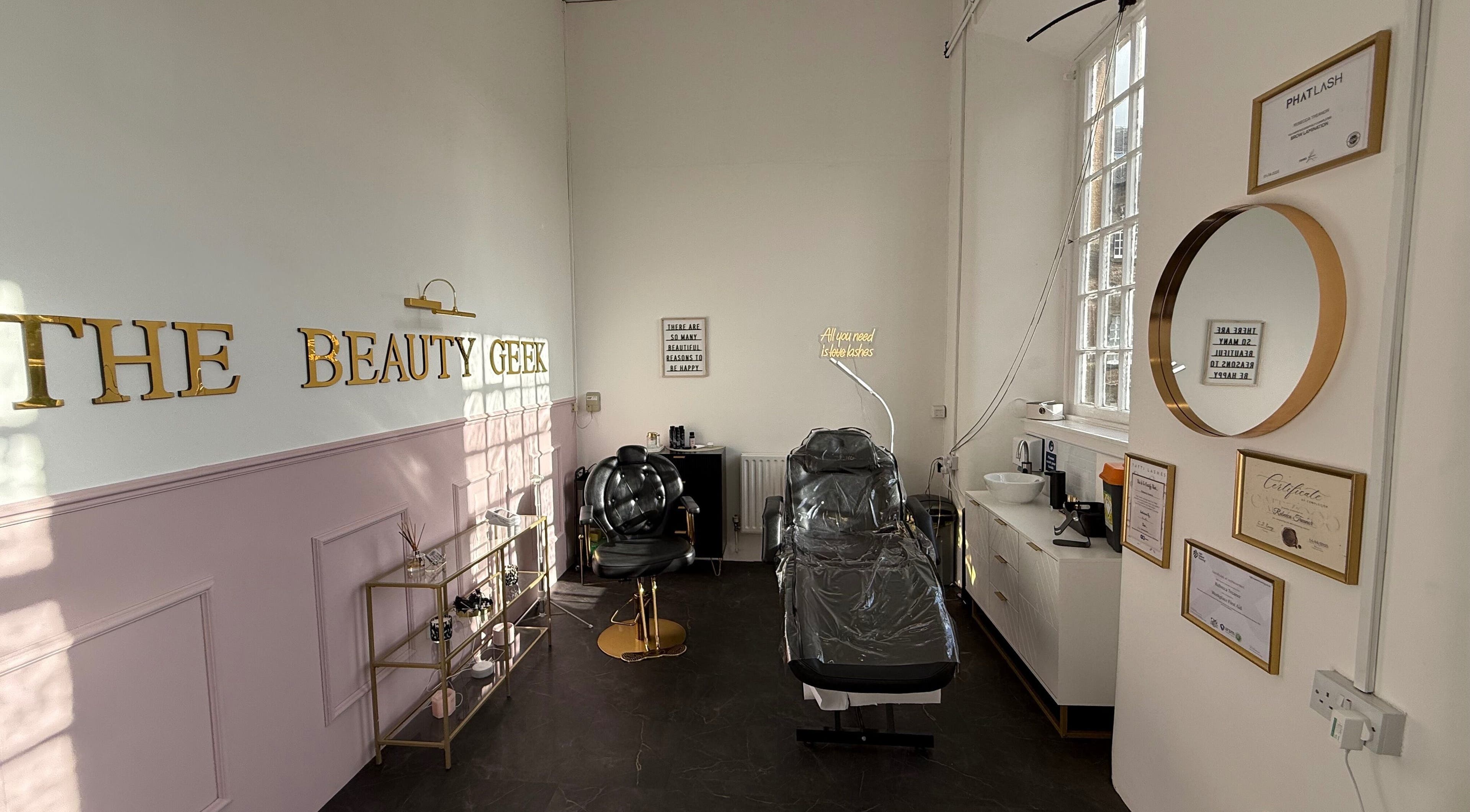 Elegant interior of The Beauty Geek UK in Paisley, Scotland, GB showcasing stylish treatment chairs and decor.
