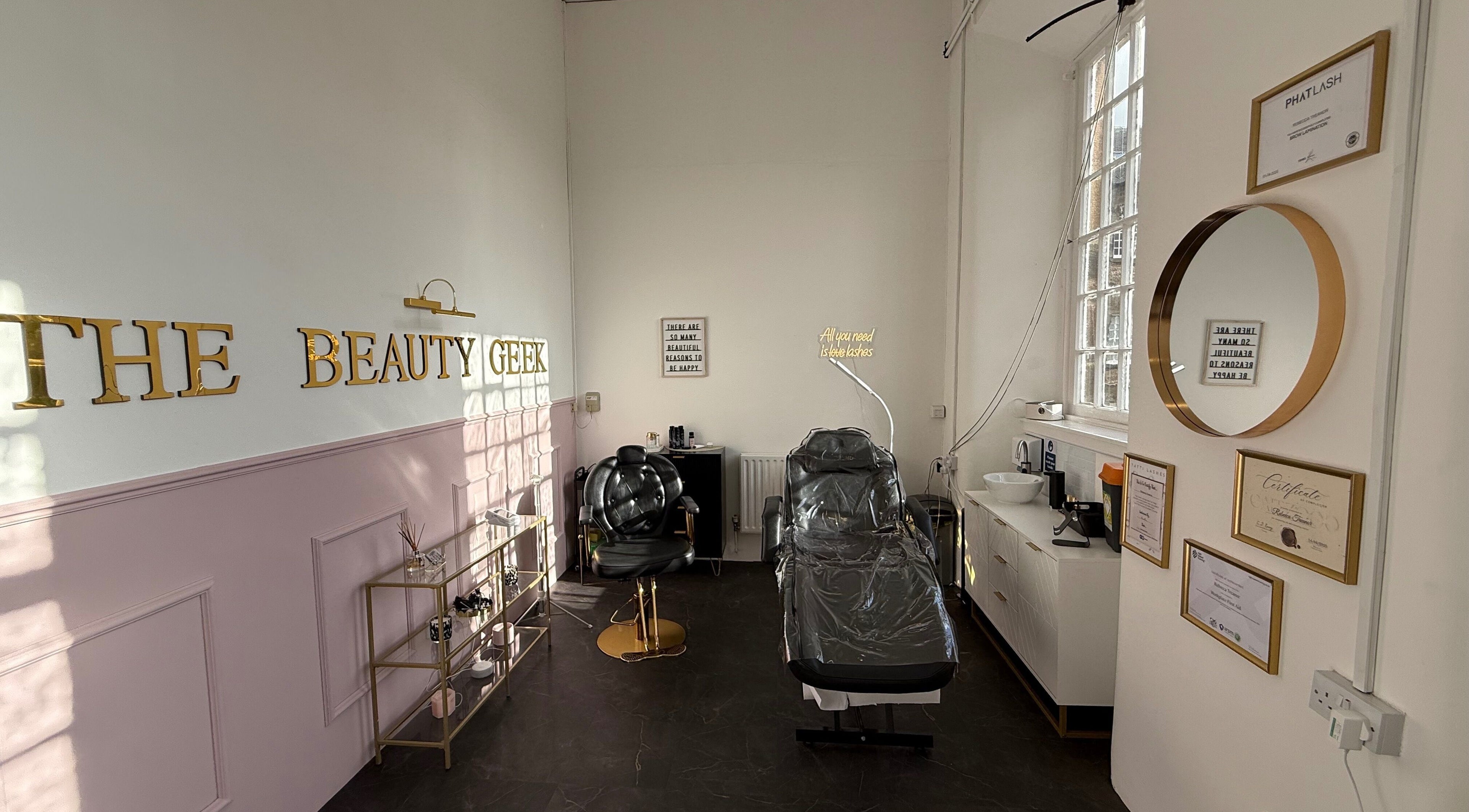 Elegant interior of The Beauty Geek UK in Paisley, Scotland, GB showcasing stylish treatment chairs and decor.