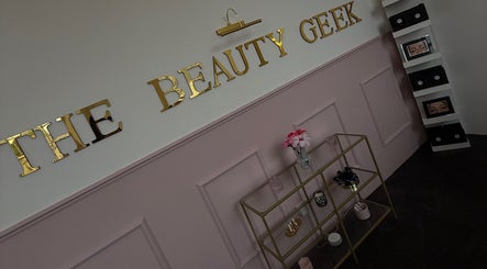 Elegant display at The Beauty Geek UK in Paisley, Scotland, GB featuring gold lettering and decor.