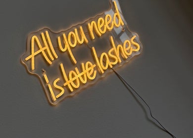 Neon sign at The Beauty Geek UK in Paisley, Scotland, GB reads 'All you need is love lashes'.