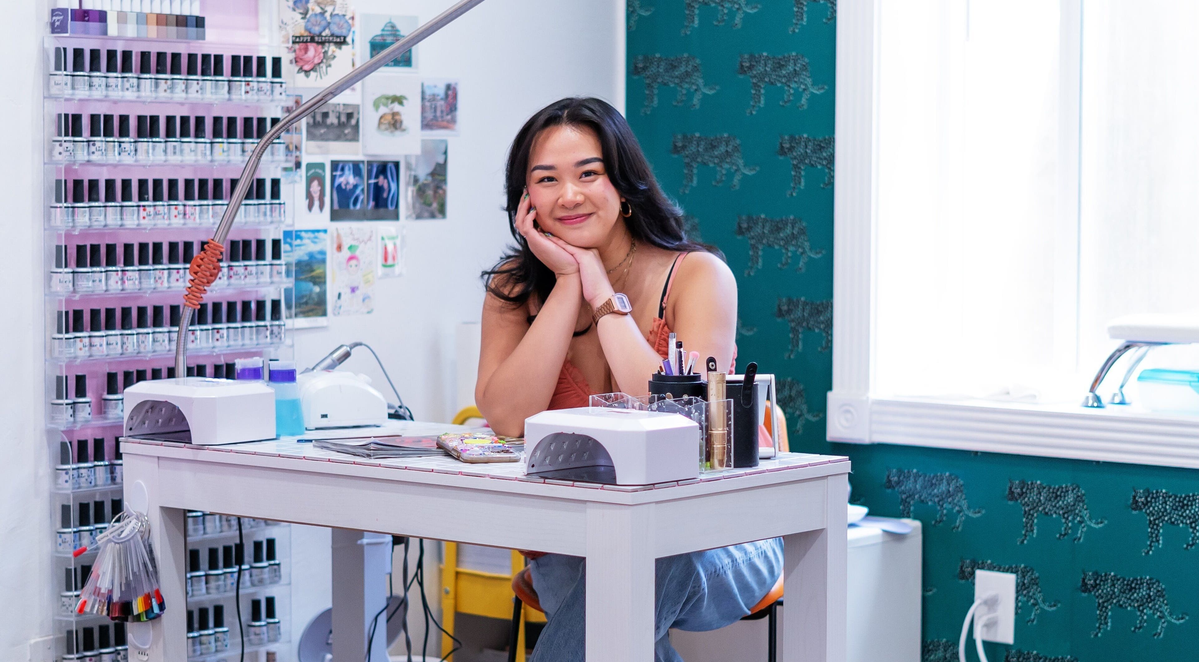 Smiling nail artist at Eggkeys! Nails by Thea C.K., Salt Lake City, Utah, US inviting you in.