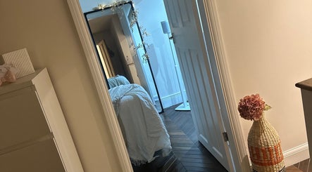 Relaxing treatment room at Aesthetics by Kinga Jambor in Nottingham, England, GB, with ambient lighting.