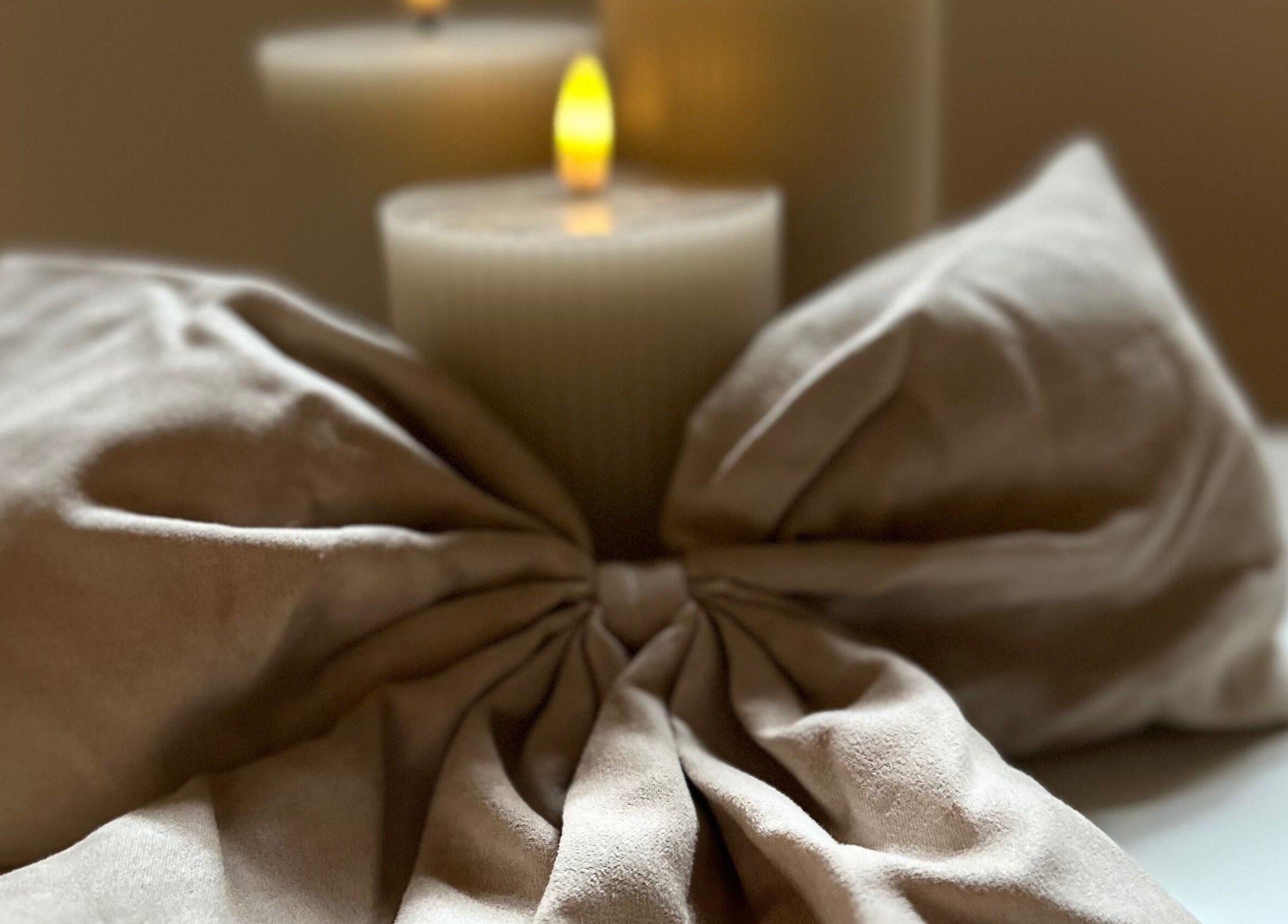 Elegant candles and fabric at Aesthetics by Kinga Jambor, Nottingham, England, GB creating a tranquil ambiance.