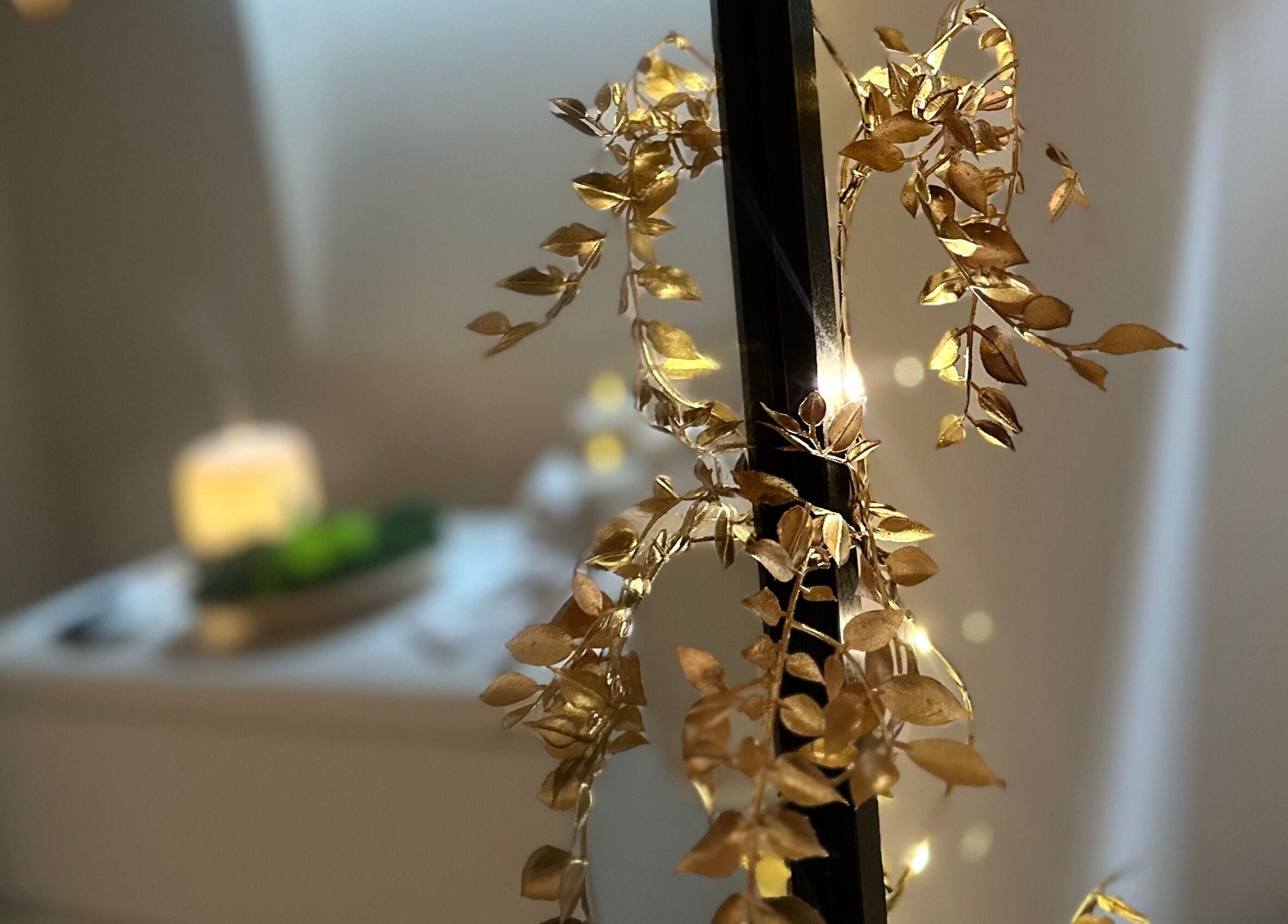 Golden decorative leaves at Aesthetics by Kinga Jambor, Nottingham, England, GB, creating a serene ambiance.