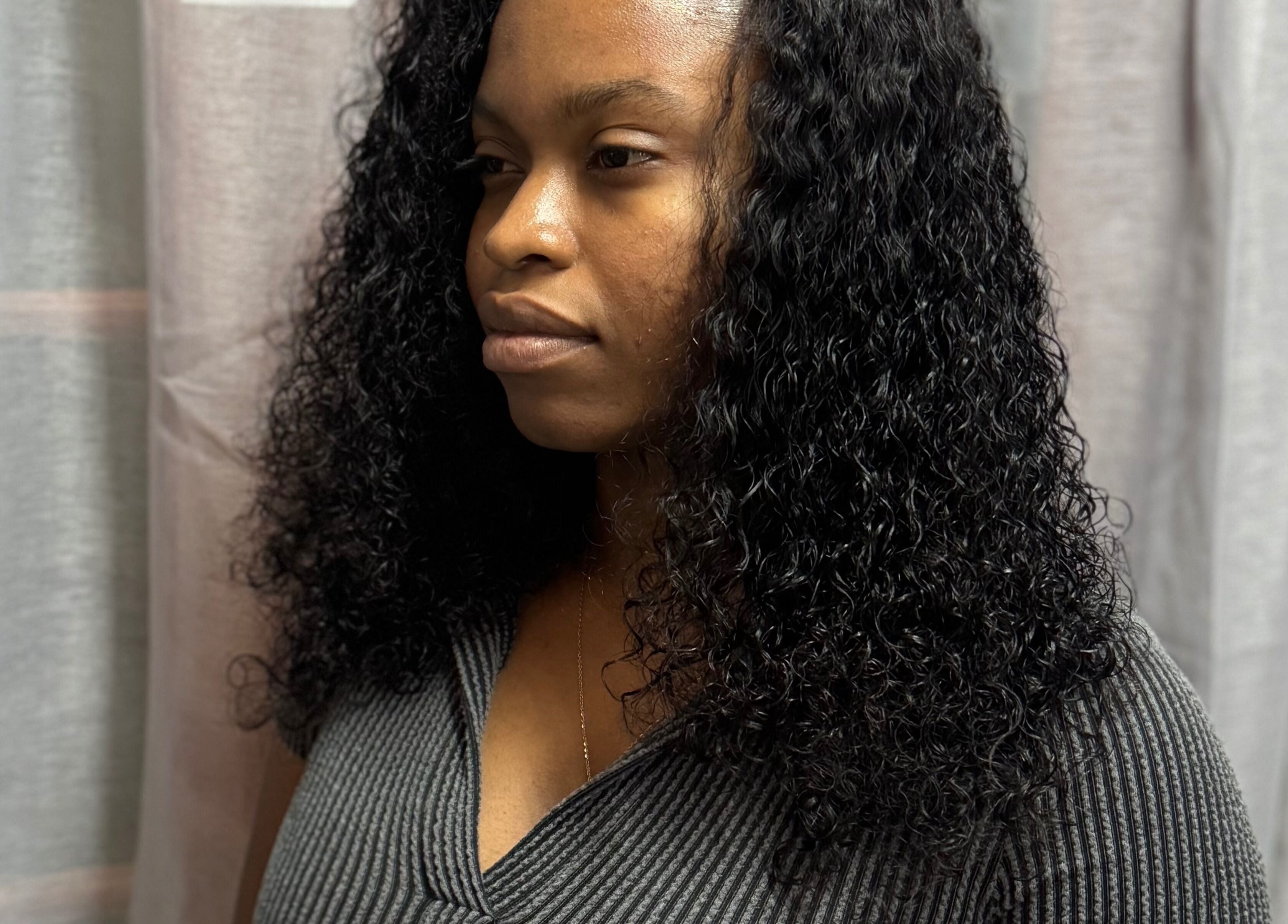 Woman with styled curly hair at Fro and Glo Beauty, Bridgetown, Saint Michael, BB.