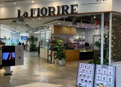 Entrance of La FIORERE Korean Hair Salon 1 Mont Kiara, Kuala Lumpur, showcasing modern design and greenery.