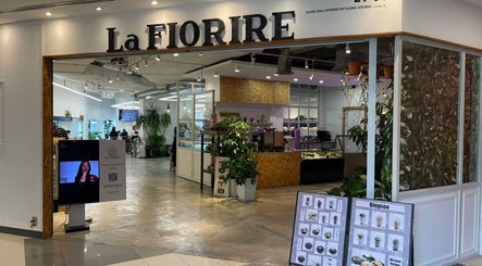 Entrance of La FIORERE Korean Hair Salon 1 Mont Kiara, Kuala Lumpur, showcasing modern design and greenery.