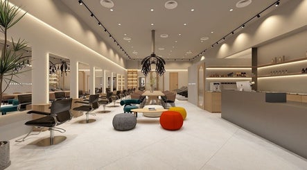 Modern interior of La FIORIRE Korean Hair Salon PAVILION Bukit Jalil, Kuala Lumpur, featuring sleek chairs and decor.