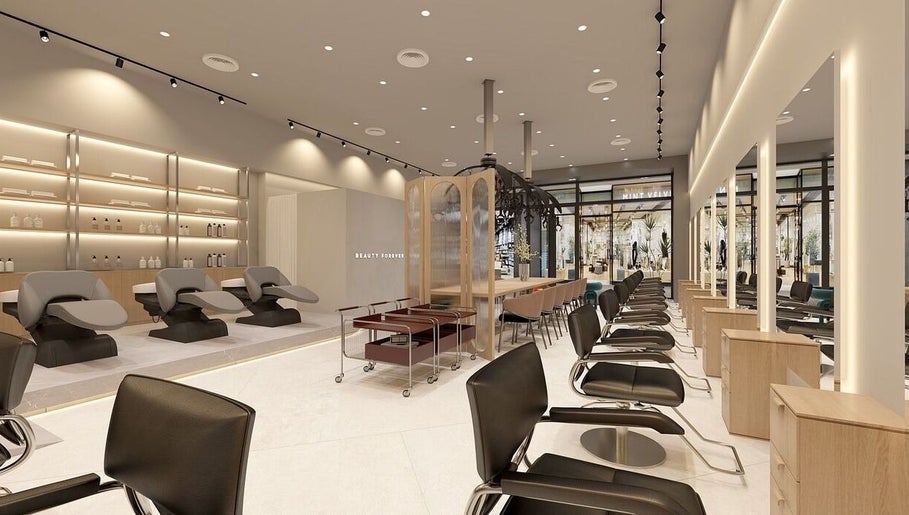 Modern interior of La FIORIRE Korean Hair Salon PAVILION Bukit Jalil, Kuala Lumpur. Stylish salon chairs and decor.