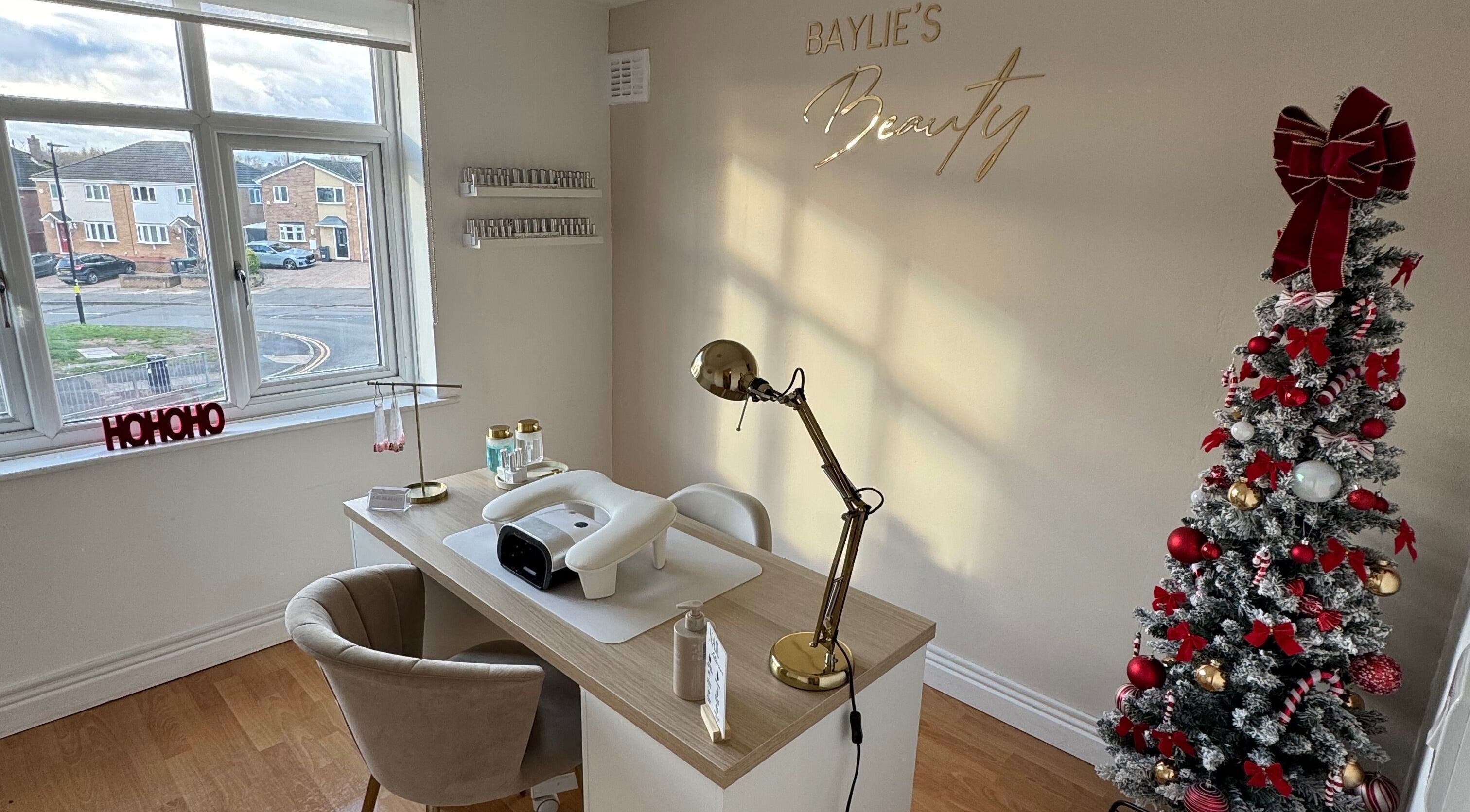 Elegant nail station at Baylie's Beauty, Birmingham, England, GB, with festive decor and cozy ambiance.