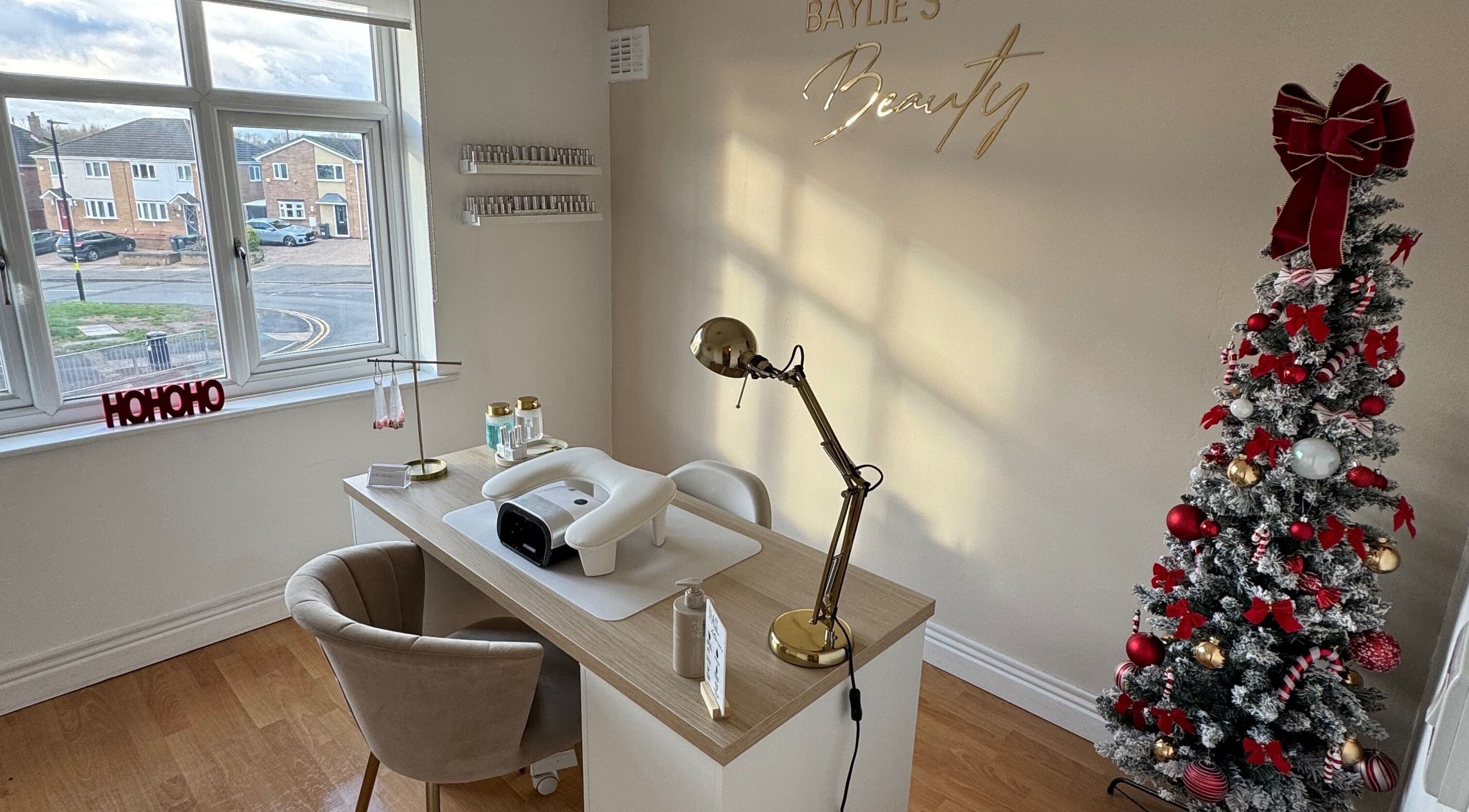 Baylie's Beauty nail station with Christmas decor, Birmingham, England, GB, showcasing festive ambiance.