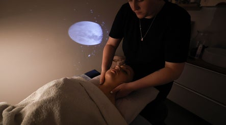 Relaxing massage under dim light at Touch Holistic Therapy, Edinburgh, Scotland, GB. A serene night ambiance.