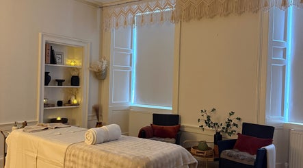Relaxing massage room at Touch Holistic Therapy in Edinburgh, Scotland, GB with soft lighting and calm decor.