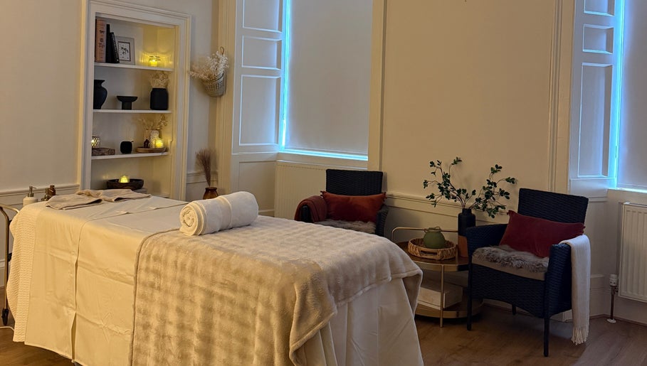 Relaxing therapy room at Touch Holistic Therapy, Edinburgh, Scotland, GB with massage bed and cozy decor.