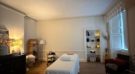 Tranquil therapy room at Touch Holistic Therapy in Edinburgh, Scotland, GB with calming decor and ambient lighting.