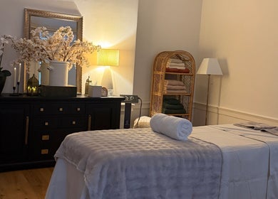 Relaxing therapy room at Touch Holistic Therapy, Edinburgh, Scotland, GB with massage table and calming decor.