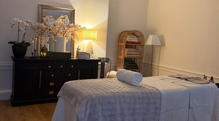 Relaxing therapy room at Touch Holistic Therapy, Edinburgh, Scotland, GB with massage table and calming decor.