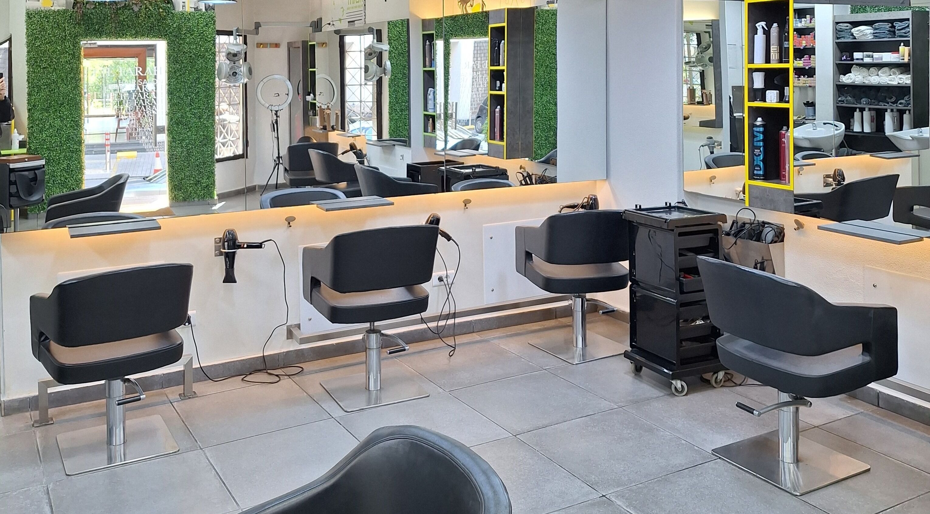 Modern interior of Elie Farah Salon in Jal El Dib, Mount Lebanon Governorate, LB with sleek styling stations.