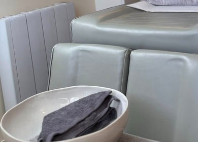 Comfortable spa chair with towel bowl at Katie Mai Beauty & Aesthetics in Stevenage, England, GB.