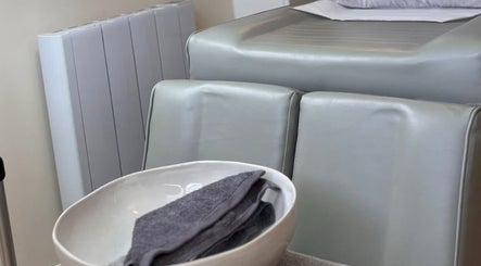 Comfortable spa chair with towel bowl at Katie Mai Beauty & Aesthetics in Stevenage, England, GB.