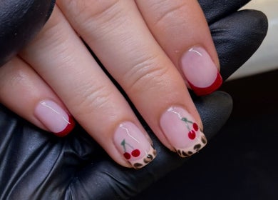 Elegant cherry nail art at Katie Mai Beauty & Aesthetics in Stevenage, England, GB showcasing detailed design.