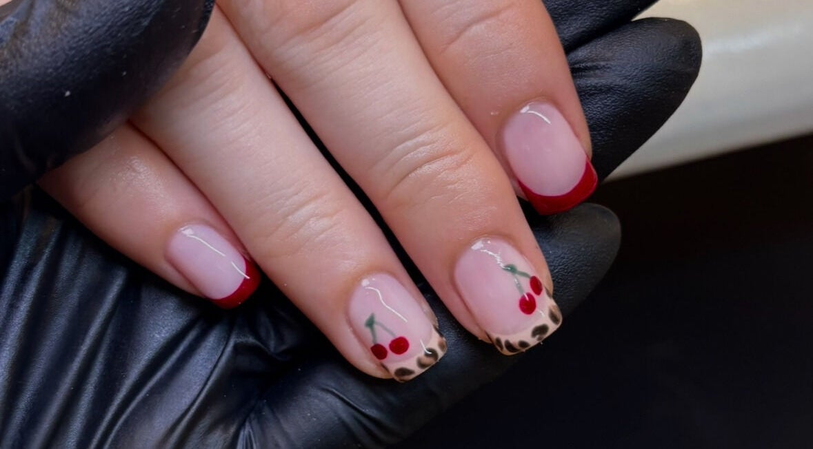 Fashionable cherry nail art at Katie Mai Beauty & Aesthetics, Stevenage, England, GB. Perfect for a trend-setting look.