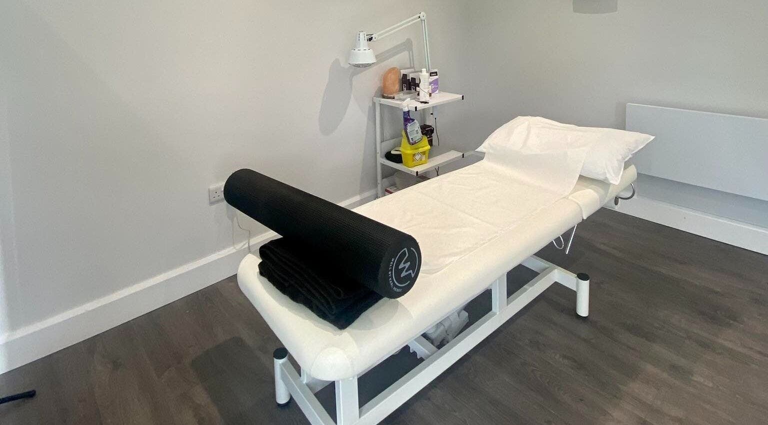 Therapy room at Crosstown Clinic in Killarney, County Kerry, IE with a massage table and wellness equipment.