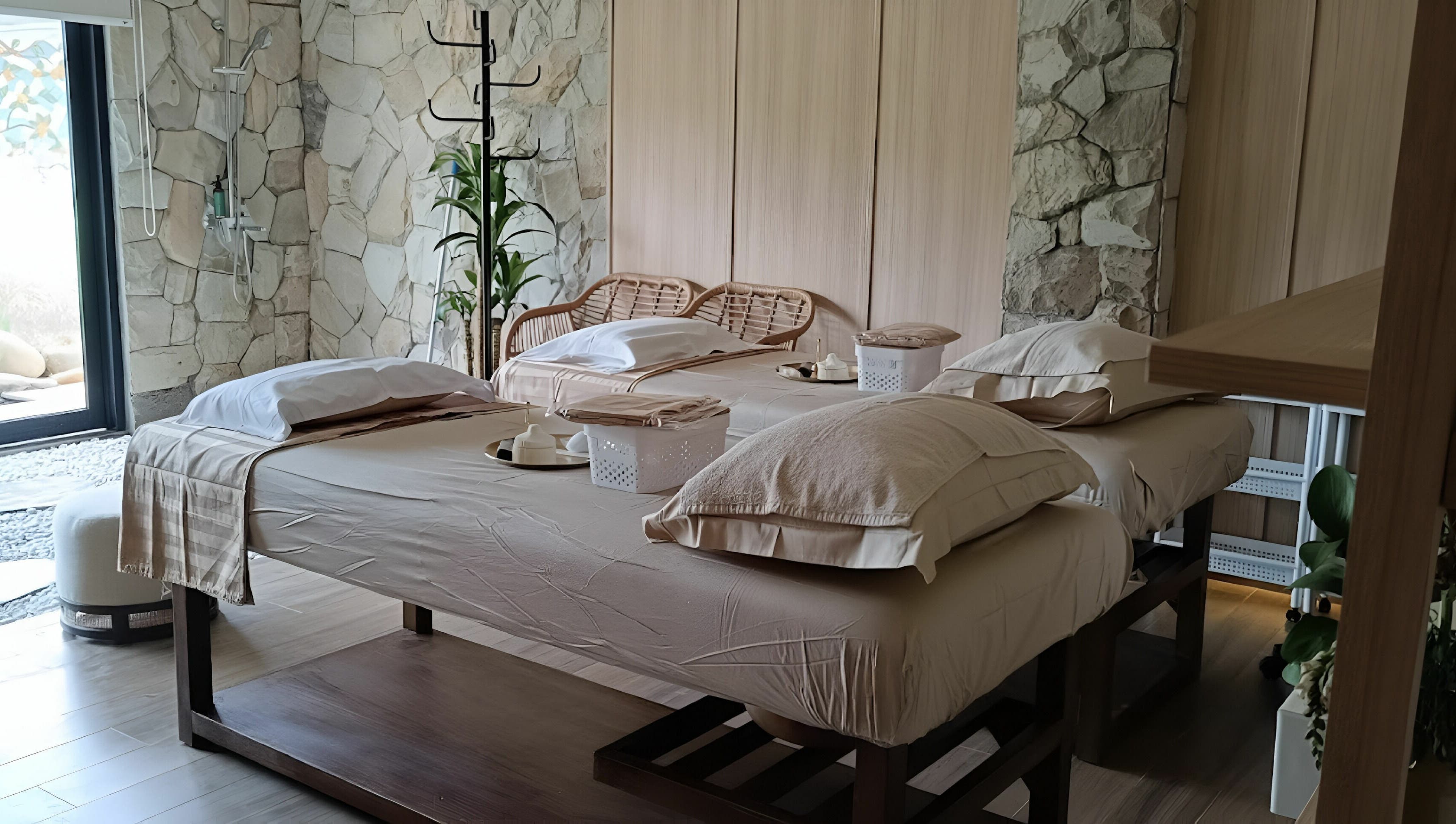 Luxurious massage room at Gaya Spa PIK, Banten, Banten, ID, featuring cozy twin beds with soothing decor.