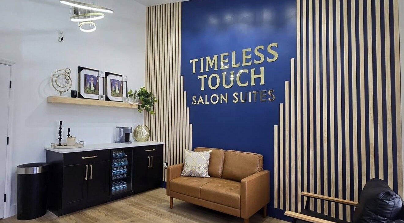 Elegant salon lobby at Kimberly’s Chair, New Port Richey, Florida, US, featuring modern decor and comfortable seating.